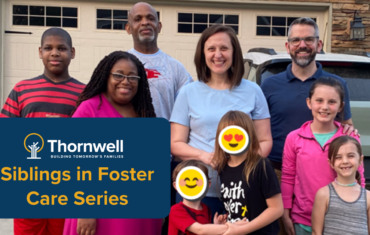 Group of eight people posing in front of a house; blue banner reads 'Thornwell Siblings in Foster Care Series' for a foster-care feature.